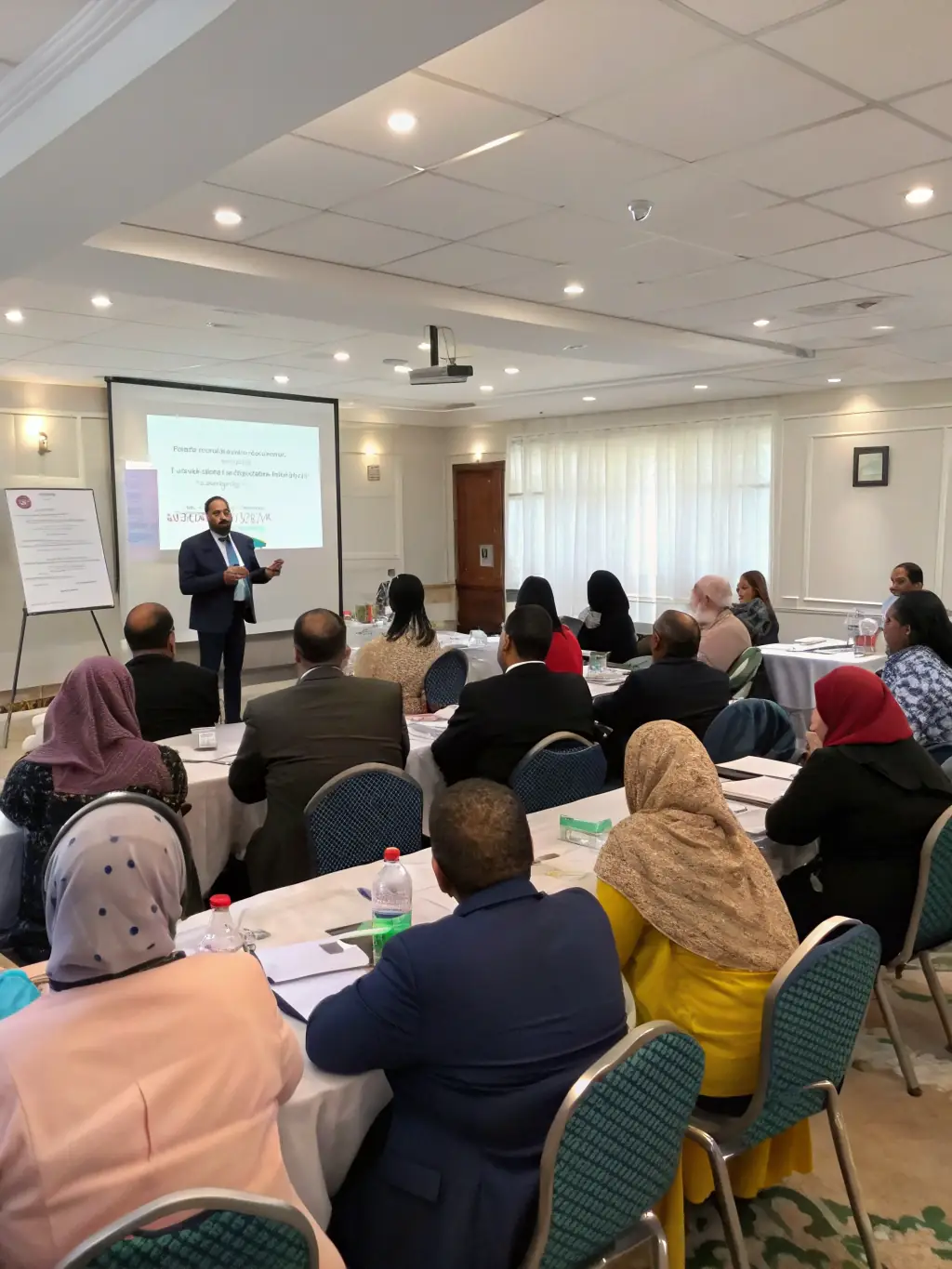 A dynamic image of a diverse team participating in a leadership workshop, emphasizing team building and collaborative problem-solving.